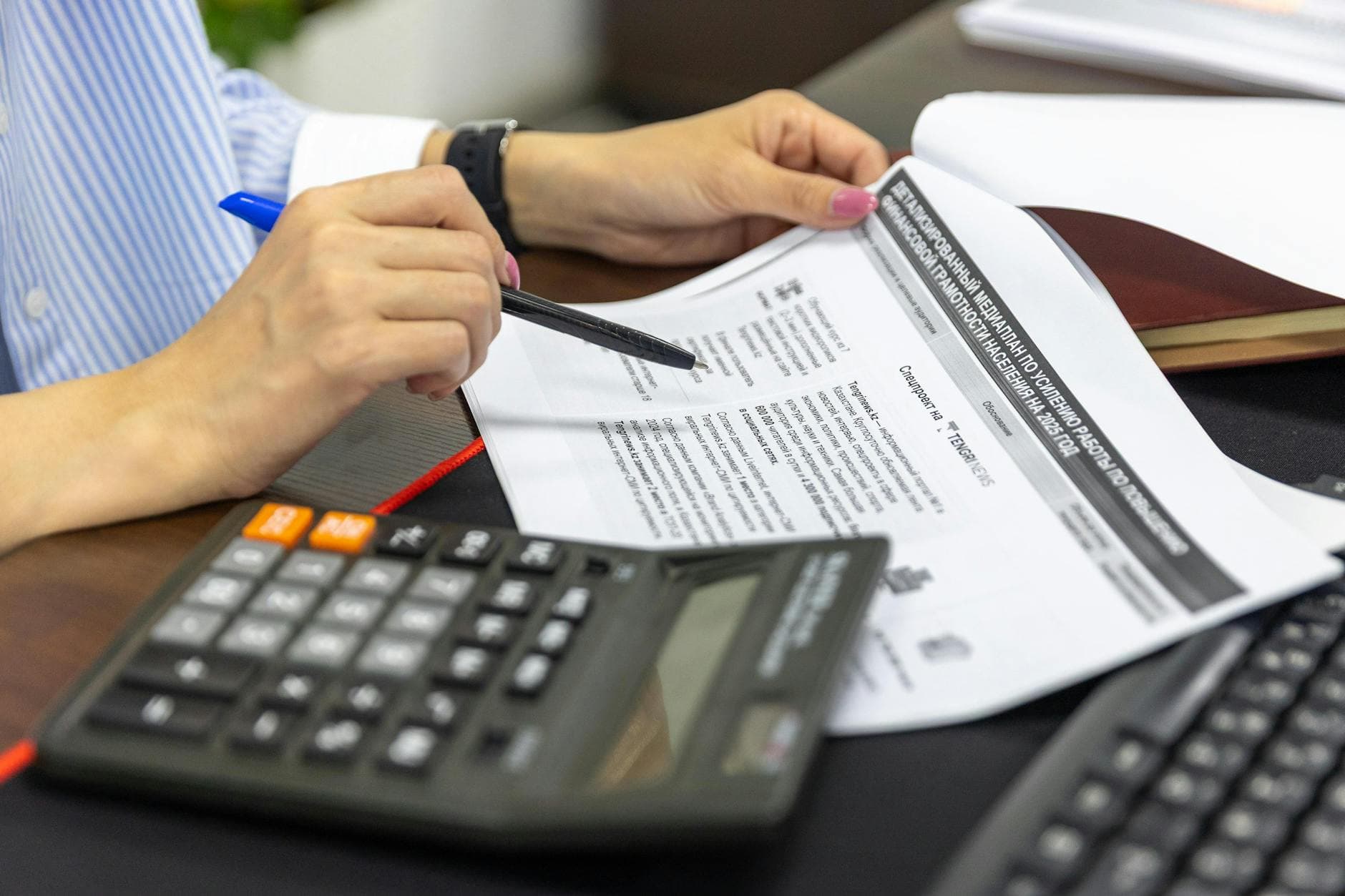 Accountant reviewing financial documents at a desk